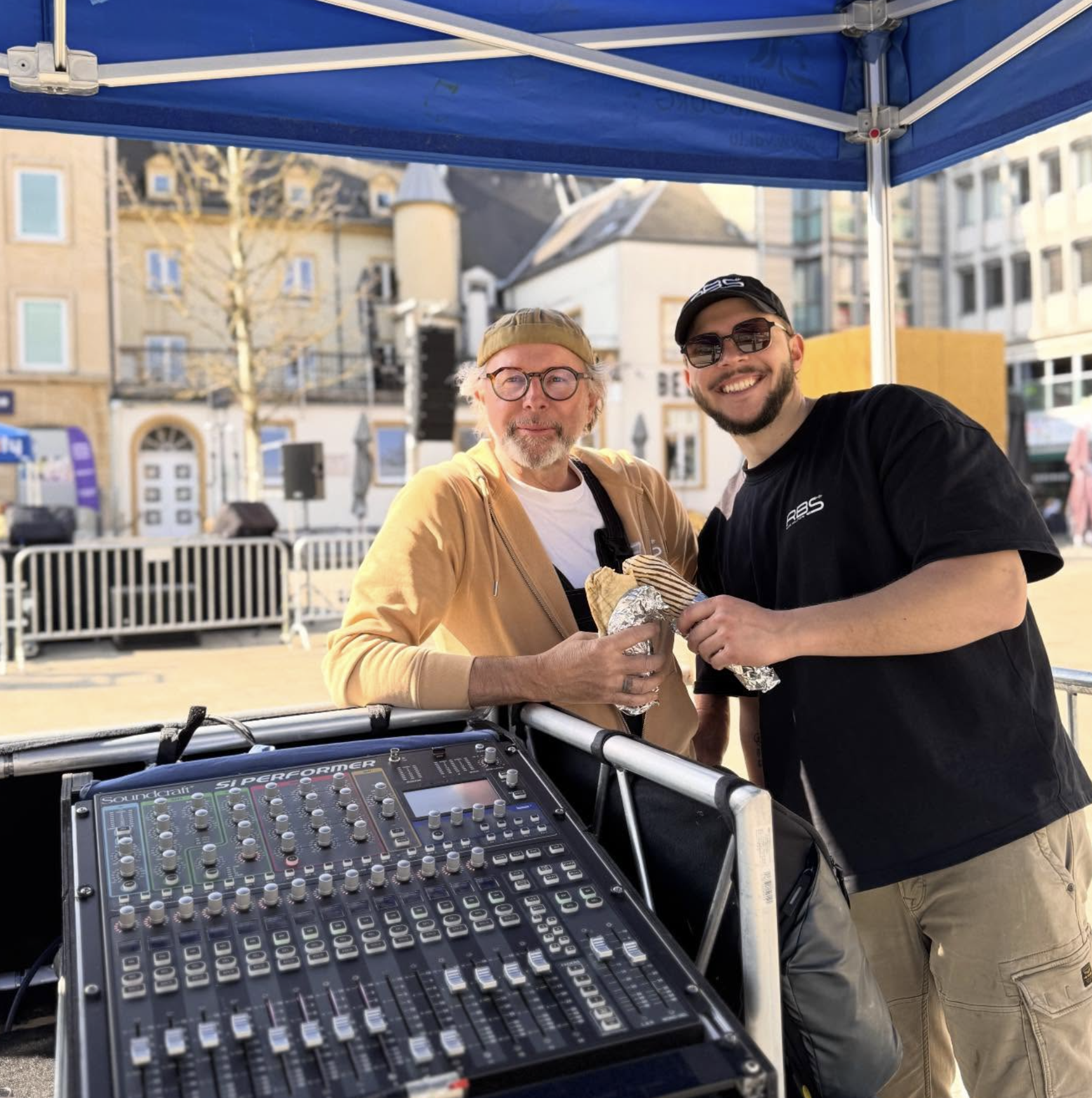Two RBS team members working at a live sound setup